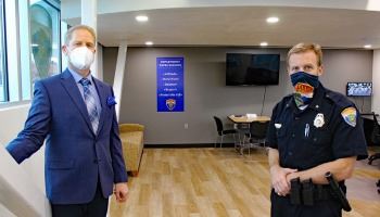Shaun Menchaca and Chief Roger Schei Schei stand in Substation #2. 